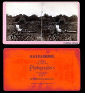 Men in rowboat by irrigation waterfall for De Bary's grove - Enterprise, Florida