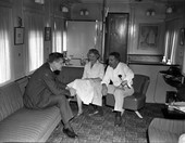 Mr. and Mrs. Graham Spickard with Joe Grotegut, left, in their rail car mobile home at the Dale Mabry Industrial Park in Tallahassee.