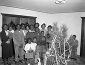 Group gathered around the Christmas tree in Tallahassee.