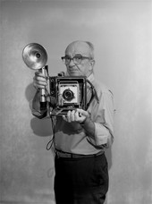Associated Press photographer Frank E. "Pappy" Noel posing with his camera in Tallahassee.