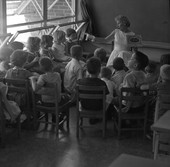 Kindergarten teacher Mrs. Gene Berkowitz reading to class in Tallahassee.