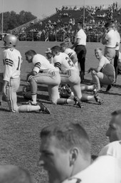 FSU offensive ends coach Bobby Bowden on sideline with players during game in Tallahassee against the University of Kentucky.
