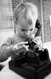 Nursery school child playing with phone in Tallahassee.