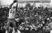 FSU wide receiver #25 Fred Biletnikoff catching the football during game against the University of Oklahoma at the Gator Bowl in Jacksonville.