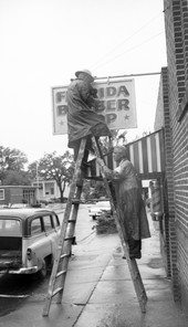 Sign from the Florida Barber Shop in Tallahassee being removed in preparation of Hurricane Alma.