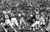 FSU quarterback #11 Kim Hammond dropping back to pass during game against PSU at the Gator Bowl in Jacksonville.