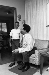 Unidentified boy with Cannonball Adderley at his father's home in Tallahassee.