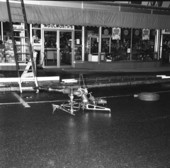 View showing Tallahassee Fire Dept. firefighting equipment in the street during Florida Theatre fire at 118 North Monroe Street in Tallahassee, Florida.