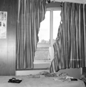 Curtain damaged during arson fire to a house at 1122 N. Bronough St. in Tallahassee, Florida.