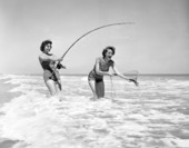 Freda Jones and June Ramsey surf casting at Daytona Beach.