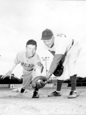 Coach Jim Keesey shows 2nd baseman Charlie Young some pointers - Saint Augustine, Florida