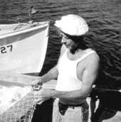 Commercial fisherman mending nets.
