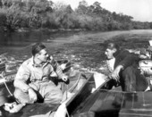 Charlie Anderson and Bill Buford in a boat .