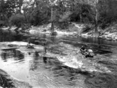 Von Walker, Wyatt Blassingame and Bill Buford ride the rapids .