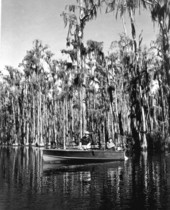 Von Walker and Rod Warren boating in the Okefenokee Swamp .
