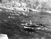 Howe Sadler and Bill Buford run the rapids in the Suwannee River.