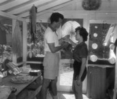 Honeymooners Jim and Lyn shop in one of the island stores - Sanibel Island, Florida .