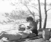 Honeymooners picnic on the beach - Sanibel Island, Florida .