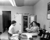 Flower broker, Margaret Haliczer with unidentified employee in her office - Lee County, Florida .