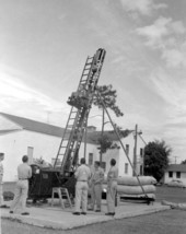 Unidentified men test ejector seat for aircraft - Eglin Air Force Base, Florida .