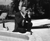 Unidentified man tests water in a swimming pool - Tallahassee, Florida .