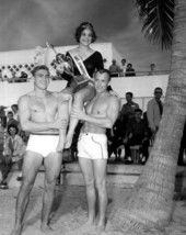 Ernest Peterson and Jerry Hall lift the National Gymnatic Queen, Kathy Maloney