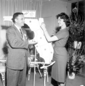 Unidentified man and woman with map at the Florida Showcase exhibit in New York.