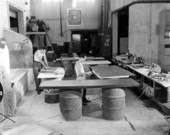 Worker finishing desk tops - Hialeah, Florida .
