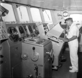 Captain on the bridge of the boat Discoverer