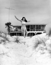 Seafood Queen runs down the dunes - Saint George Island, Florida .