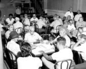 Retirees play dominoes