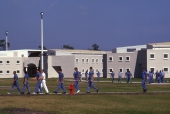 Inmates walking in the courtyard at the Hardee Correctional Institution in Bowling Green.
