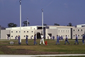 Inmates walking in the courtyard at the Hardee Correctional Institution in Bowling Green.