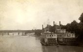 Steamboats Naiad, left, and Fannie Fearn on the Chattahoochee River at the Columbus, Georgia wharf.