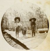 Two children with their catch of fish in Apalachicola, Florida.
