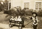 Ray Alley Jr. pulling wagon with brother and cousins in it during Christmas in Groveland, Florida.