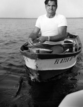 Columbus White, commercial fisherman on his boat - Alachua County, Florida