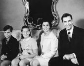 Askew family poses for a photo on sofa - Tallahassee, Florida.
