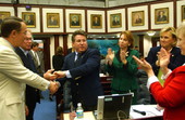 Rep. Frank Farkas, R-St. Petersburg, center, prime sponsor of the Affordable Health Care bill (HB1629), is congratulated by colleagues after the measure upon House approval Friday, April 23, 2004..