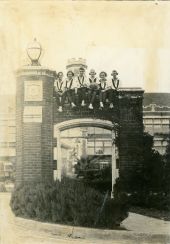 FSCW basketball team sitting atop Westcott gate - Tallahassee, Florida.