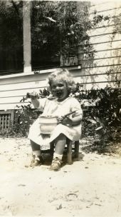 Nancy Tribble (later Benda) eating from a pot in DeLand.