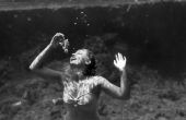 Nancy Tribble (later Benda) eating grapes during a performance as a mermaid at Weeki Wachee Springs.