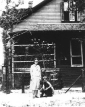 Cecilia and Max Kilbourn in front of Kilbourn home