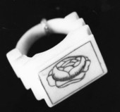 Ceramic carved ring with rose insignia