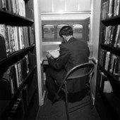 View of a Pine Crest School student reading in the library - Fort Lauderdale, Florida