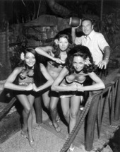 Mai Kai girls with football player in garden at Mai-Kai Restaurant.