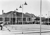 People enjoying a game of shuffleboard