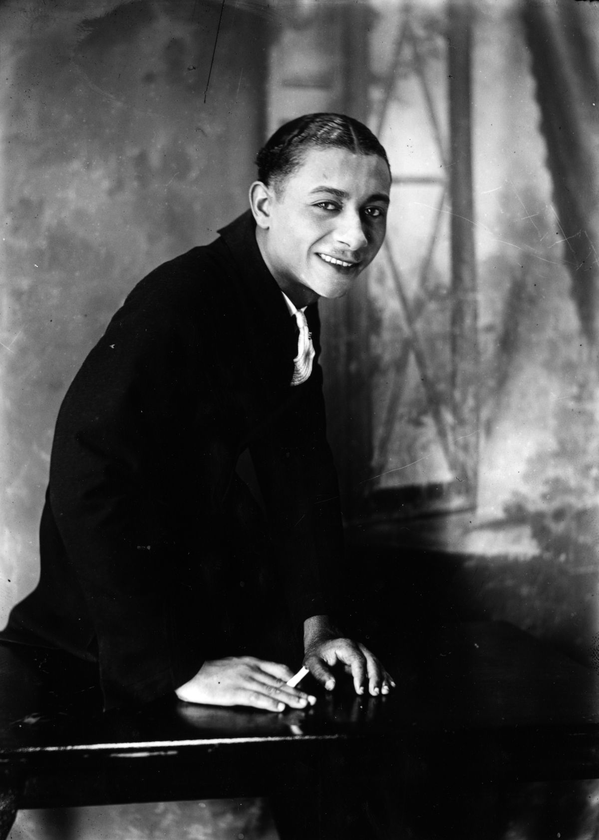 Leroy Parsons holding a cigarette