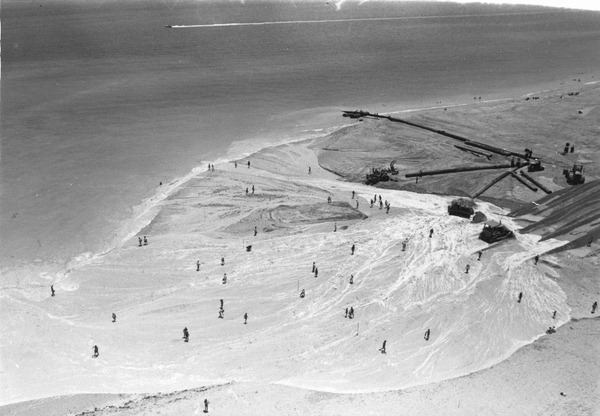 Pipes expelling sand, water, and shells for new beach - Surfside, Florida