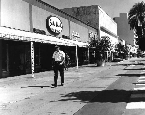 Foot patrolman working at the pedestrian mall - Miami Beach, Florida.